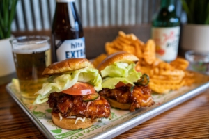 kimchi guys fried chicken sliders with chips and a beverage